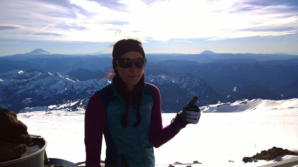 Photo: Annette. St. Helens, Adams, and Hood all in the background from Camp Muir. You'd think I'd be more excited but it was so windy I could barely smile!